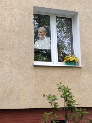 pope poster in window